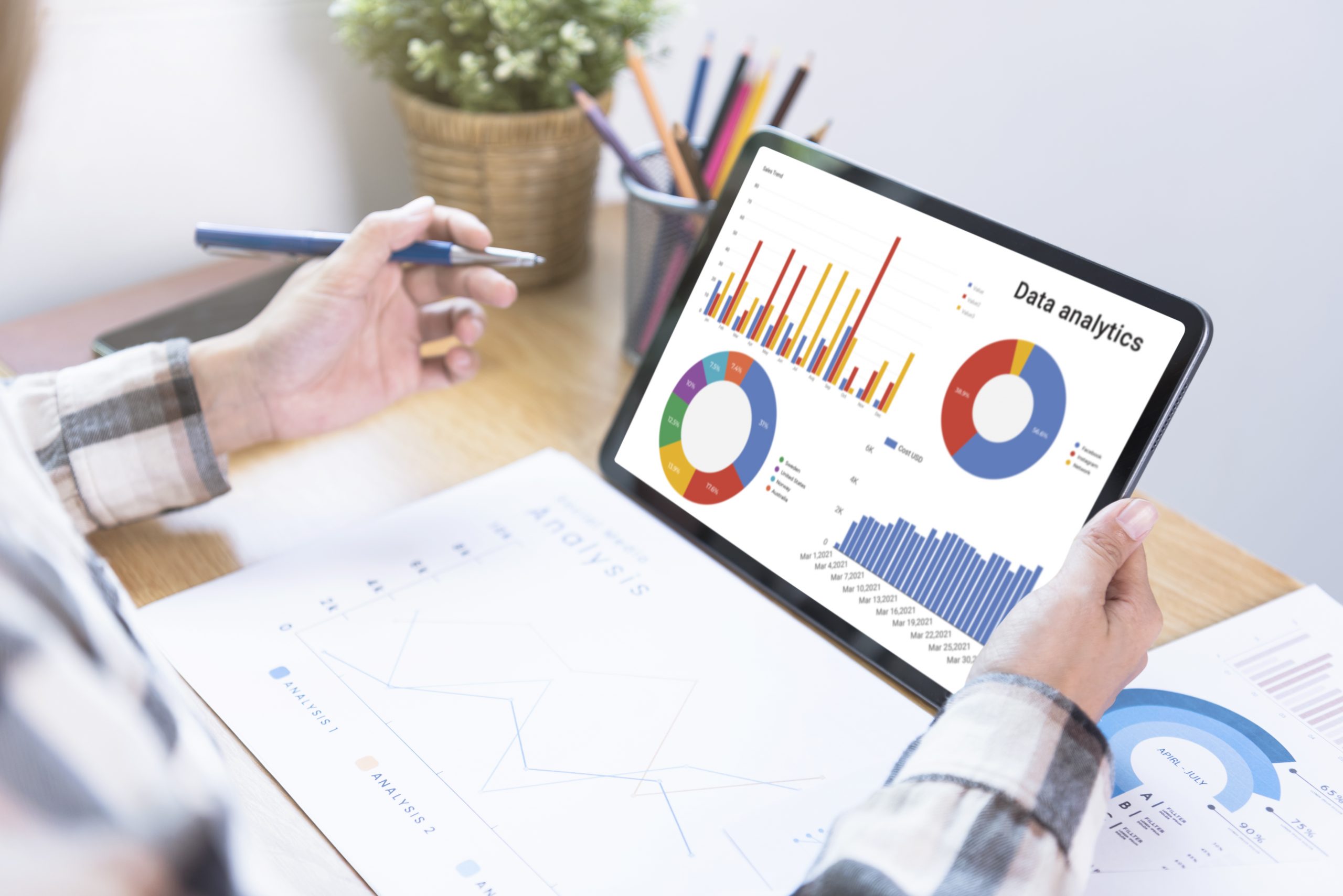 businesswoman using a tablet to analysis graph company finance s