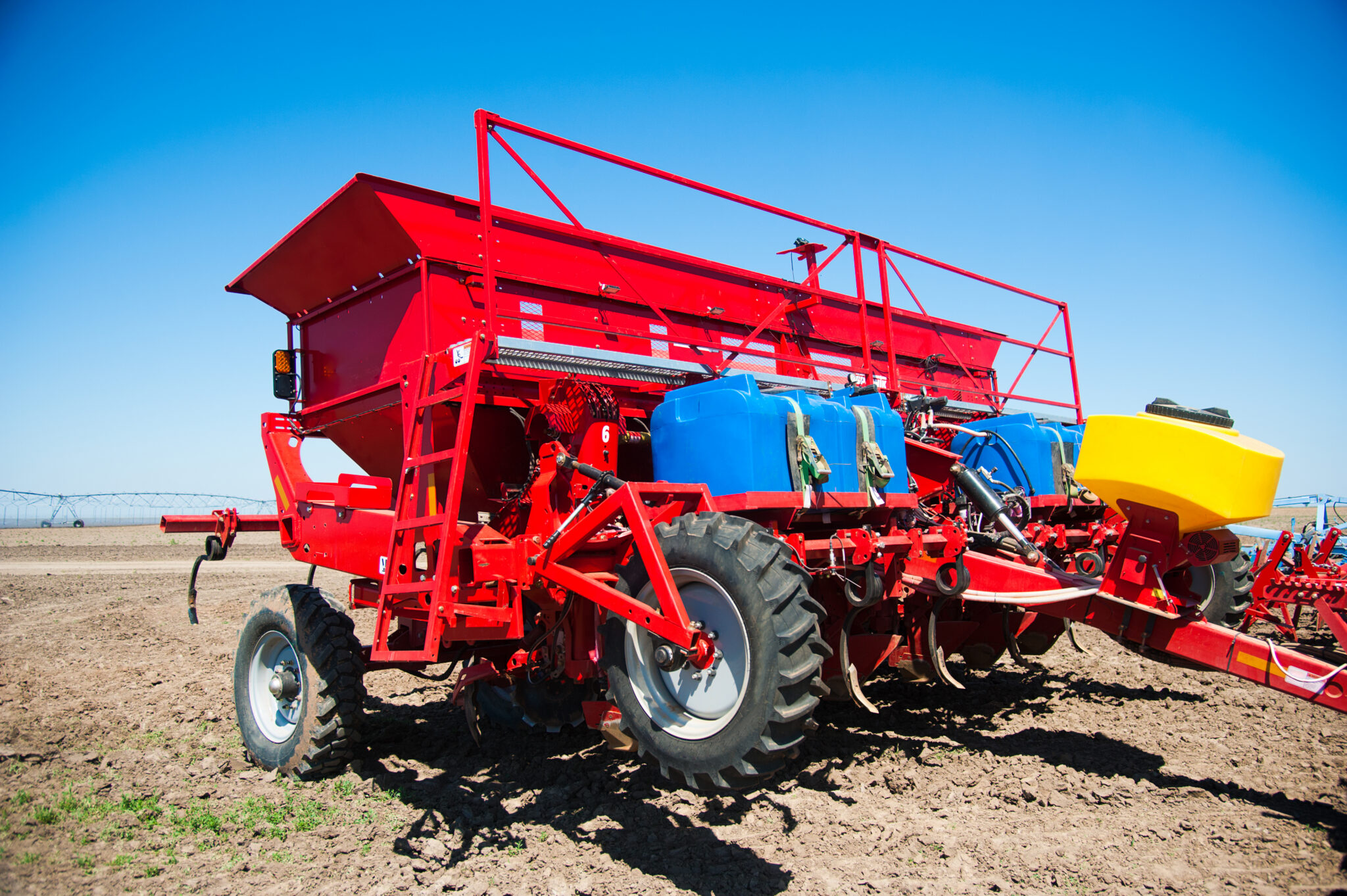 red agricultural seeder equipment in a field 2026 03 26 07 52 59 utc 2048x1363